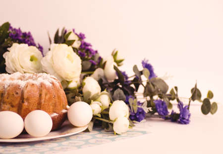 Traditional Easter cake and easter eggs with flowers