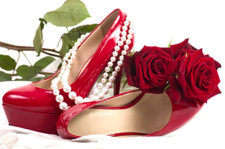 Red sexy shoes with pearls beads and rosesの写真素材