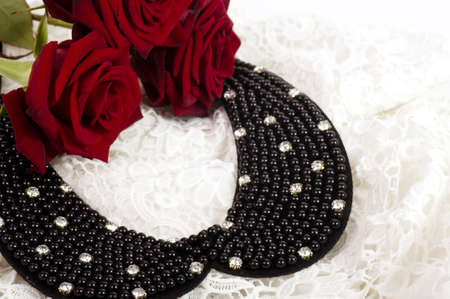Pearl necklace with red roses