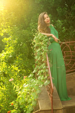 Beautiful woman in spring gardenの写真素材