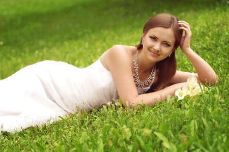 Beautiful bride with stylish make-up in white dressの写真素材