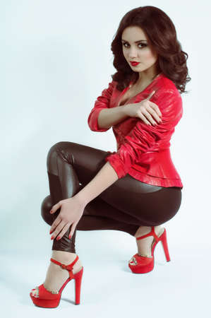 Portrait of beautiful young woman with makeup in fashion clothesの写真素材