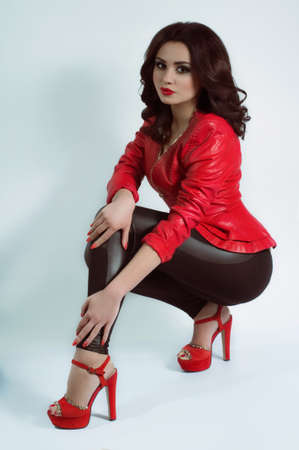 Portrait of beautiful young woman with makeup in fashion clothesの写真素材