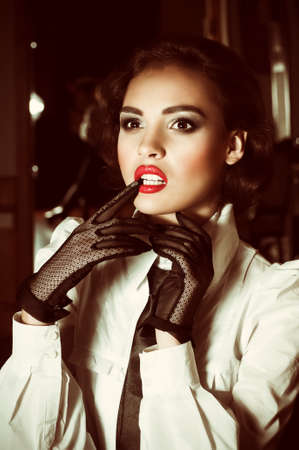 Portrait of beautiful young woman with makeup in fashion clothesの写真素材