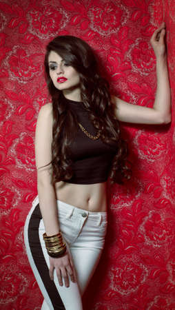 Portrait of beautiful young woman with makeup in fashion clothes