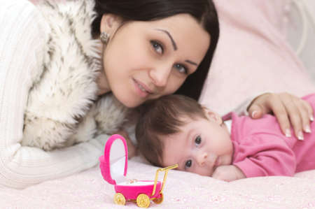 Young happy mother with baby