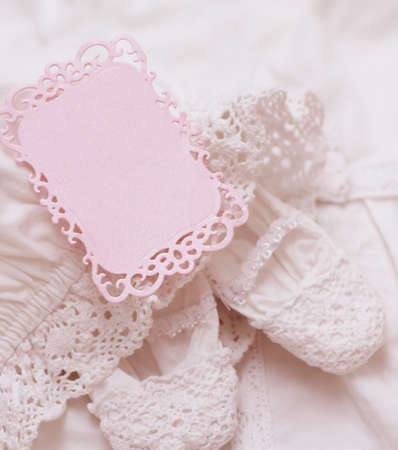 Baby shoe with blank invitation cardの写真素材
