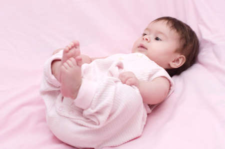 Cute little girl on pink 