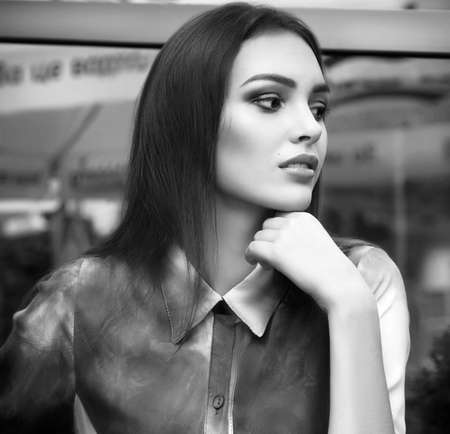 Portrait of beautiful young woman with makeup in fashion blue clothesの写真素材