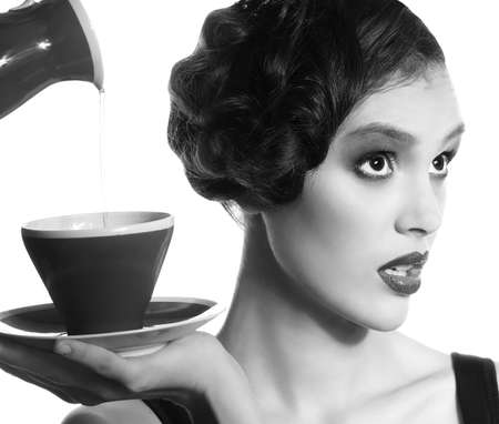 Portrait of beautiful young woman with fashion makeup and tea cup