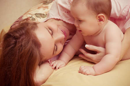Young happy mother with baby