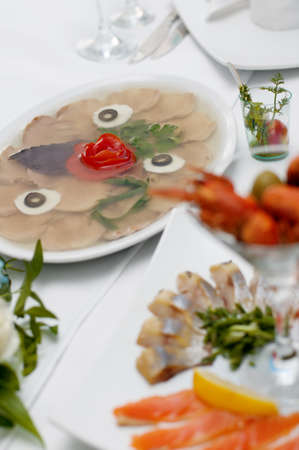 Aspic from meat decorated with egg on a festive table