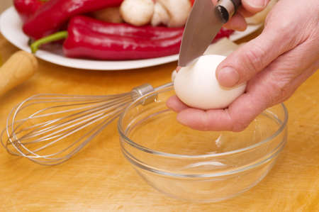 Chef baker cracking an egg