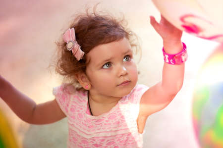 Summer portrait of beautiful baby girlの写真素材