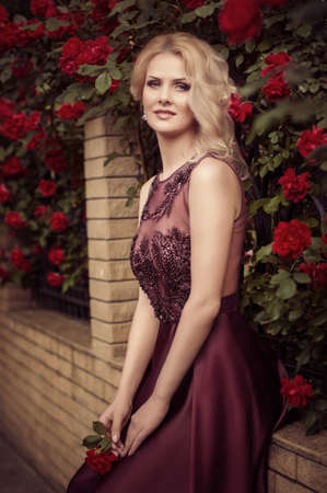 Beautiful woman in spring gardenの写真素材