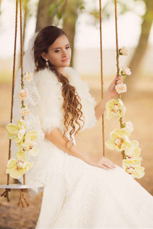 Beautiful bride with stylish makeup in white dressの写真素材
