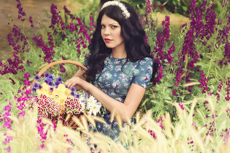 Beautiful woman in spring gardenの写真素材