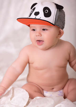 Little baby boy wearing a panda cap.の写真素材