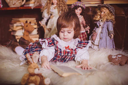 Cute charming little lady with dolls. Retro style.の写真素材