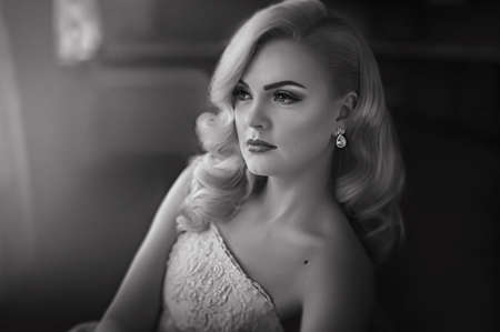 Beautiful bride with stylish make-up in white dressの写真素材