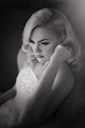 Beautiful bride with stylish make-up in white dressの写真素材