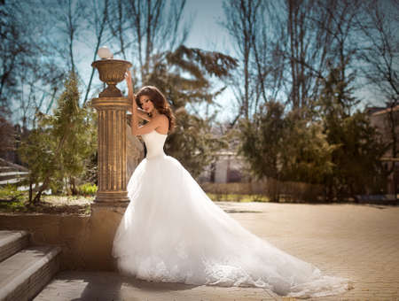 Beautiful bride with stylish make-up in white dressの写真素材