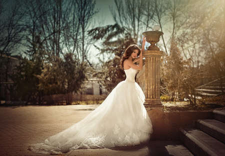 Beautiful bride with stylish make-up in white dressの写真素材