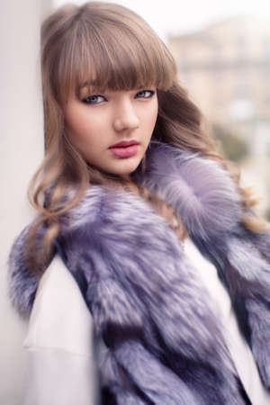 Portrait of beautiful young woman with makeup in fashion clothesの写真素材