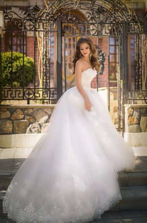 Beautiful bride with stylish makeup in white dressの写真素材