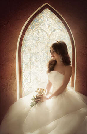 Beautiful bride with stylish makeup in white dressの写真素材