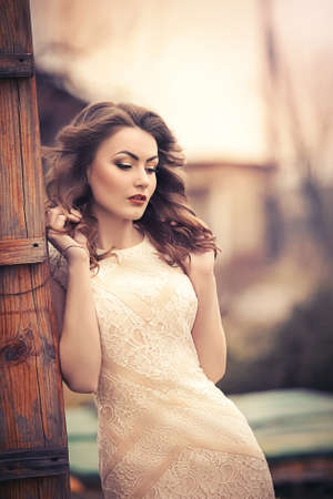 Portrait of beautiful young woman with makeup in fashion clothesの写真素材