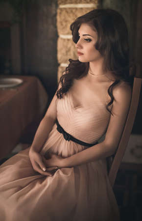 Portrait of beautiful young woman with makeup in fashion clothesの写真素材