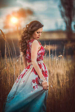 Beautiful young woman in spring gardenの写真素材