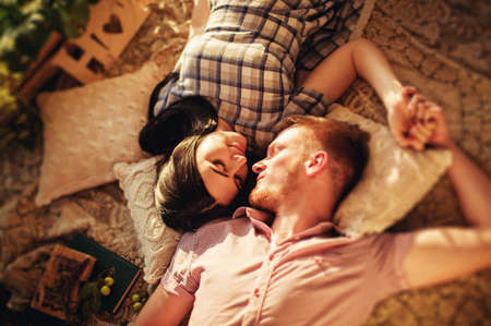 Young couple in love on park lawnの写真素材