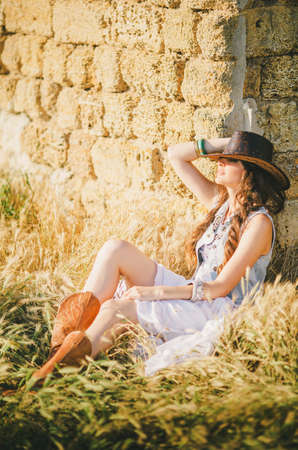 Beautiful young woman in spring gardenの写真素材