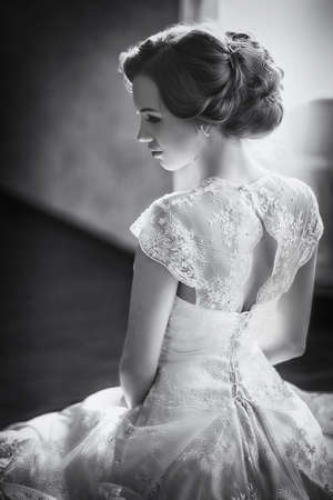 Beautiful bride with stylish make-up in white dress