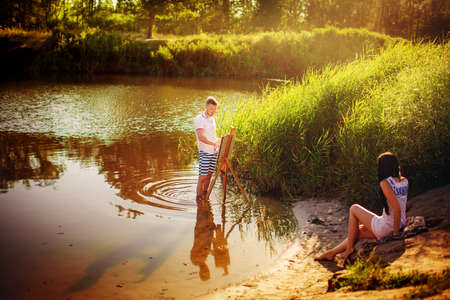 Young couple in love on park lawnの写真素材
