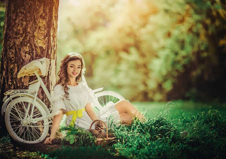 Beautiful young woman in spring gardenの写真素材