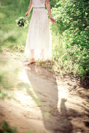 Beautiful young woman in spring gardenの写真素材