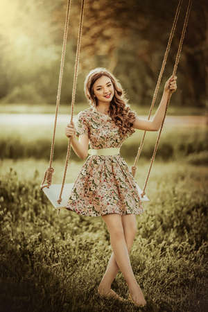 Beautiful young woman in spring gardenの写真素材