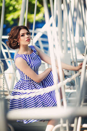 Beautiful young woman in spring gardenの写真素材
