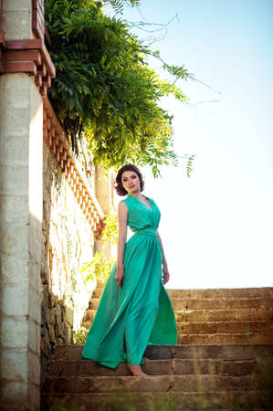 Beautiful young woman in spring gardenの写真素材