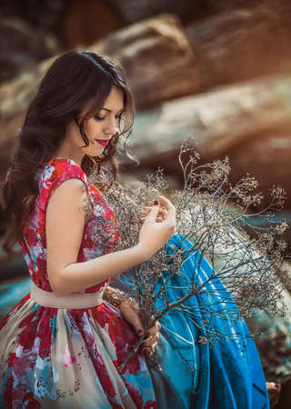 Beautiful young woman in spring gardenの写真素材