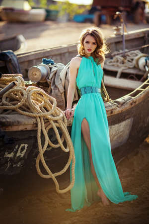 Beautiful young girl on a sea-shoreの写真素材