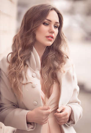 Portrait of beautiful young woman with makeup in fashion clothesの写真素材