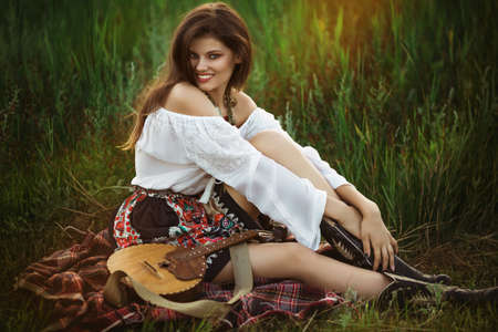 Beautiful young woman in spring gardenの写真素材