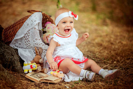Summer portrait of beautiful baby girlの写真素材