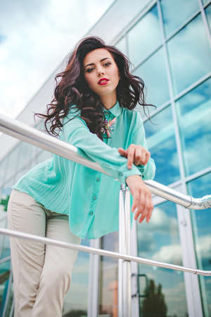 Portrait of beautiful young woman with makeup in fashion clothesの写真素材