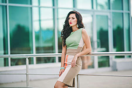 Portrait of beautiful young woman with makeup in fashion clothesの写真素材