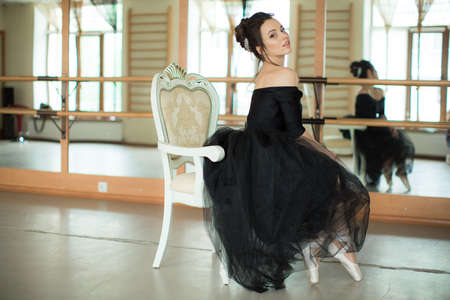 young ballerina is relaxing in class roomの写真素材